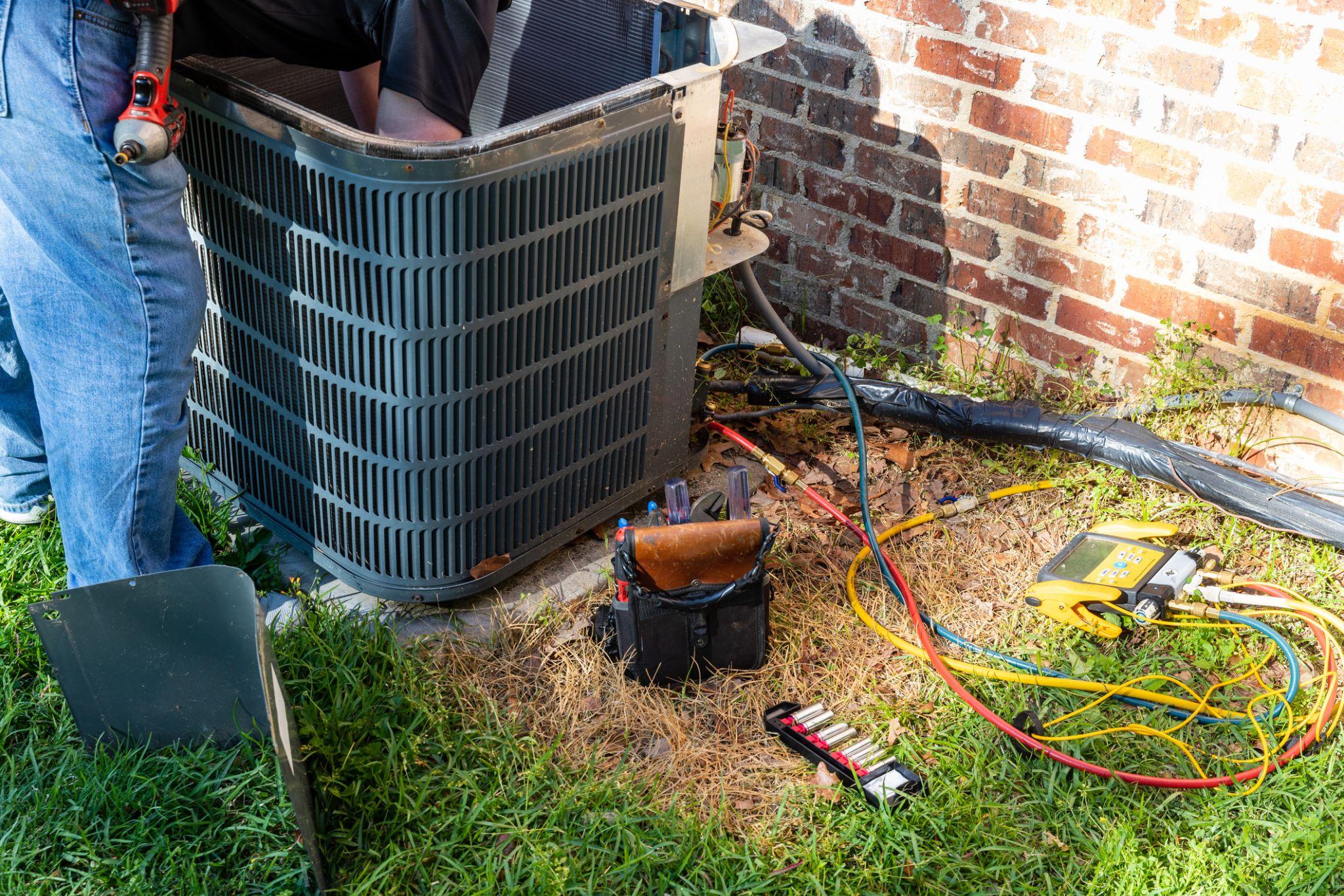 Technician performing HVAC maintenance in Darien, IL